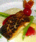Waller mit Tomaten-Basilikum-Gnocchi und glaciertem Fenchel.